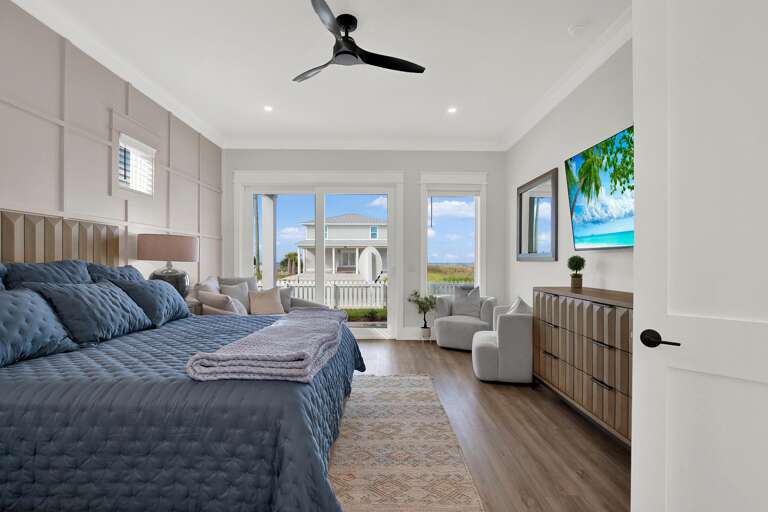 Spacious bedroom with serene water views and modern comfort