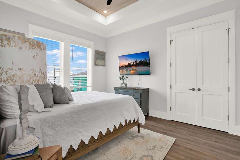 Bright and airy bedroom with serene ocean views and cozy seating