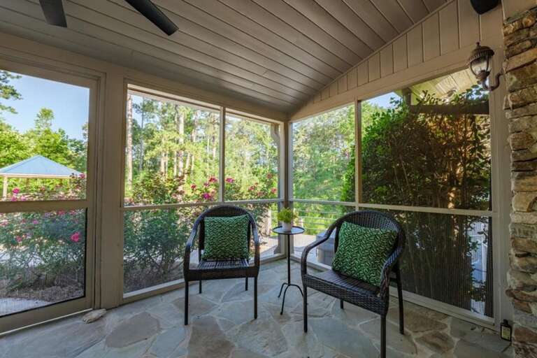 Cozy screened patio with garden views for peaceful mornings