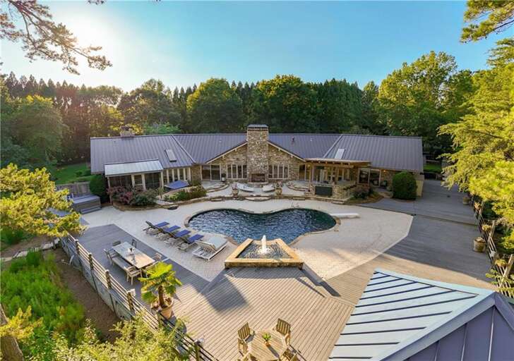 Sprawling outdoor oasis with pool and lounge areas for all Sprawling outdoor oasis with pool and lounge areas for all