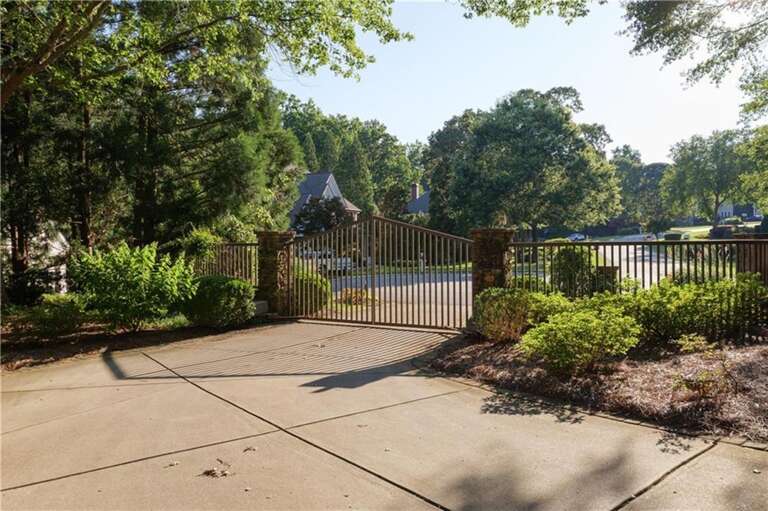 Gated entrance welcomes you to serene, lush surroundings