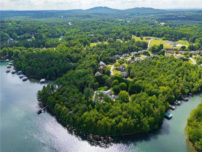 Secluded waterfront retreat surrounded by lush greenery