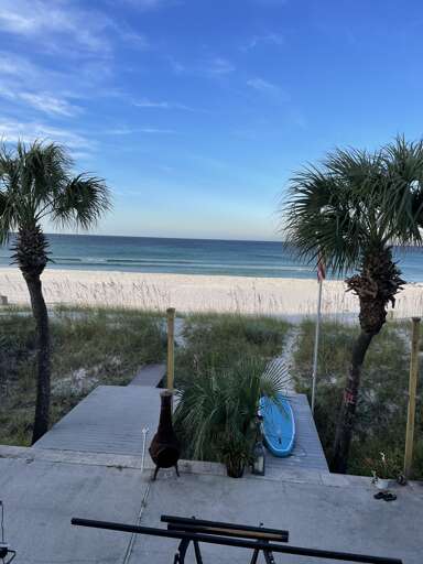 Oceanfront patio with stunning beach and palm views Oceanfront patio with stunning beach and palm views