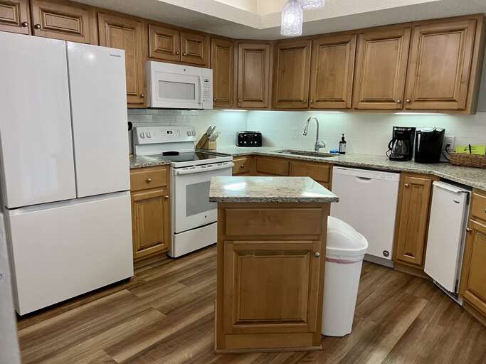 Updated kitchen has new refrigerator with ice maker and all kitchen necessities
