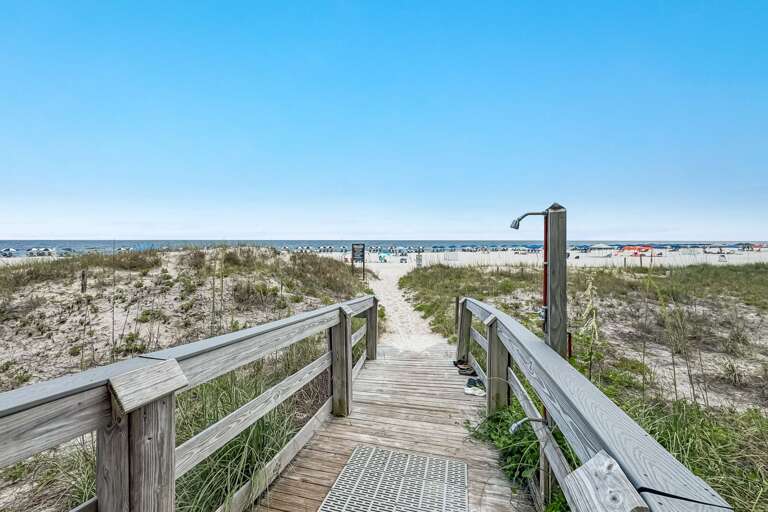 Multiple Beach Accesses with showers and hoses.