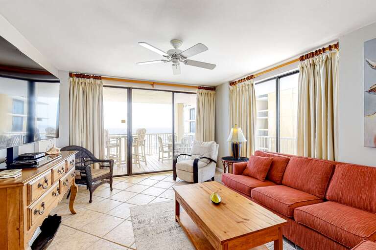 All sliding glass doors replaced in 2025!  Living room opens to the beach and wraps around the West.