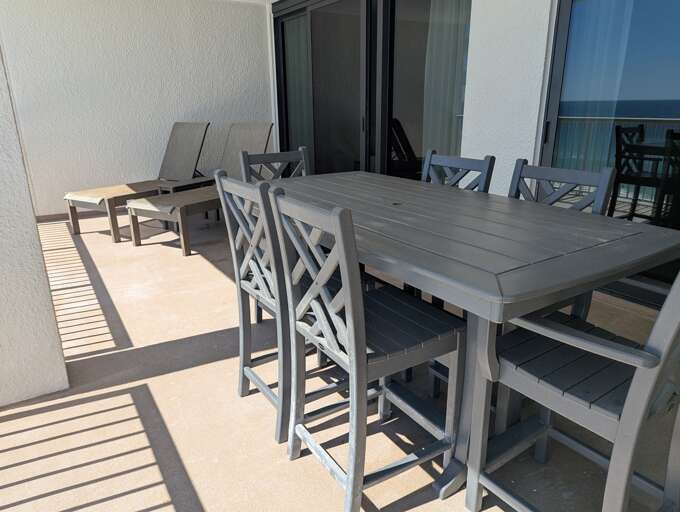 Patio is oversized with brand new coatings, exterior paint, and railings.