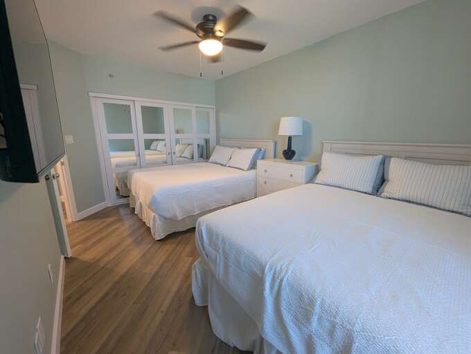 Dual queen bedroom taken from the window