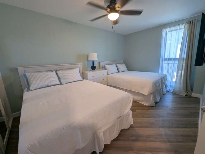 Dual queen beds taken from the doorway