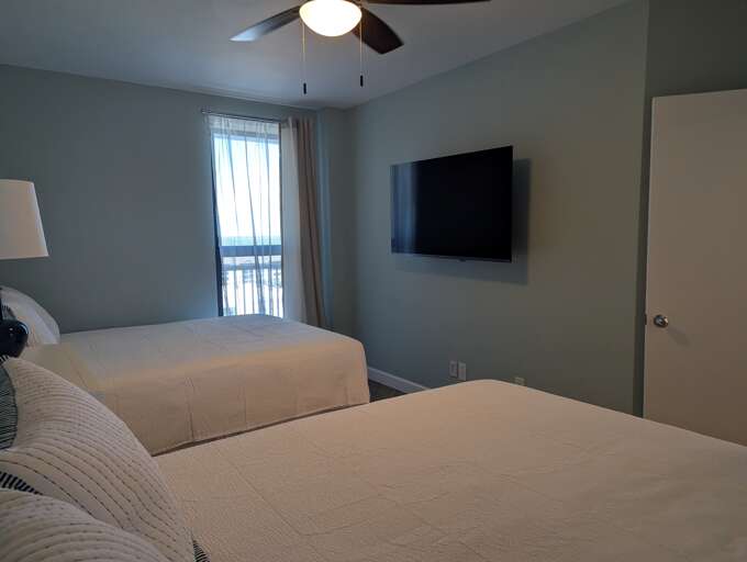 55" Roku TV in the dual queen bedroom