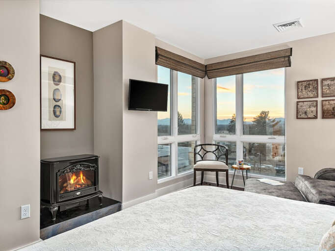Master bedroom with king bed, fireplace, amazing mountain views