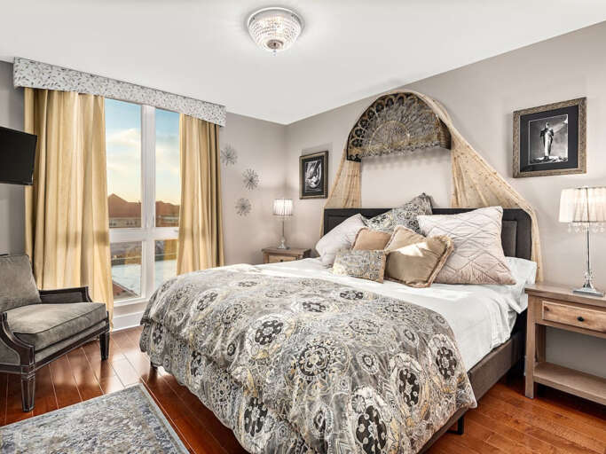Guest room with king bed. Mountain and sunset views.