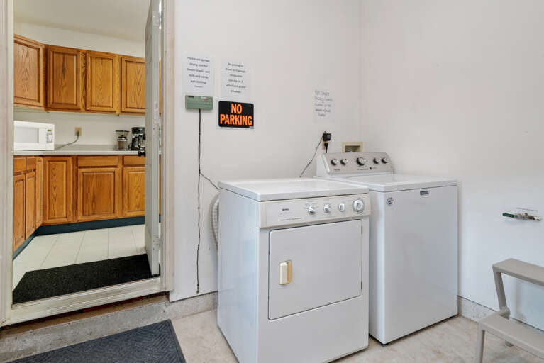 Washer and dryer located in garage off of kitchen Washer and dryer located in garage off of kitchen