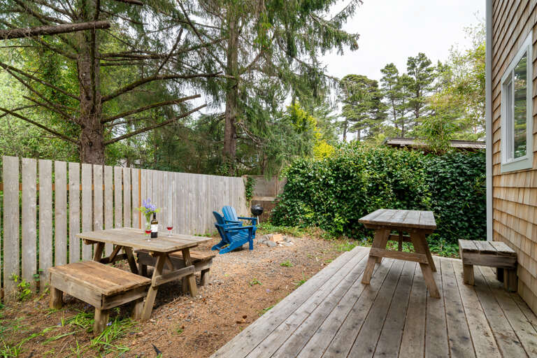 Backyard area with firepit and picnic table Backyard area with firepit and picnic table