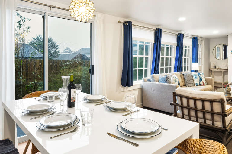 Dining and living room with access to the front deck. 