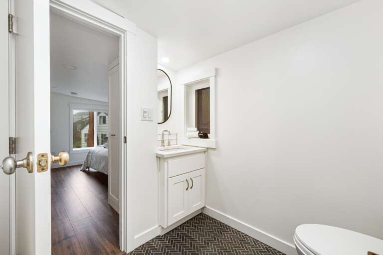 upstairs 2nd full bath with walk in shower between both queen bedrooms