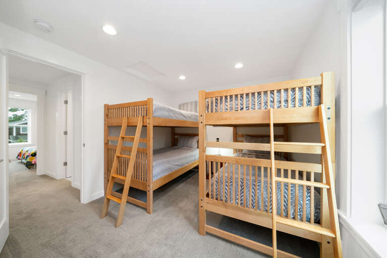 Upstairs bunk room with 2 sets of bunks