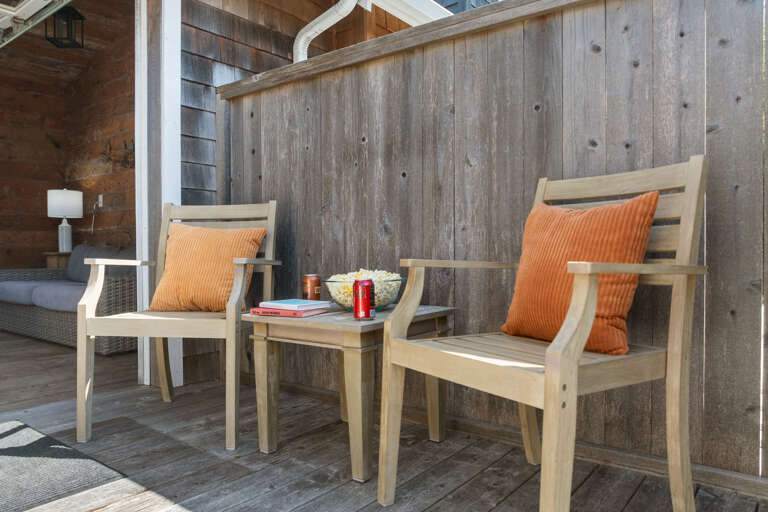 Outdoor living space with covered lounging furniture, streaming TV, dining area, open to back yard with BBQ. With uncovered sun deck for lounging Outdoor living space with covered lounging furniture, streaming TV, dining area, open to back yard with BBQ. With uncovered sun deck for lounging