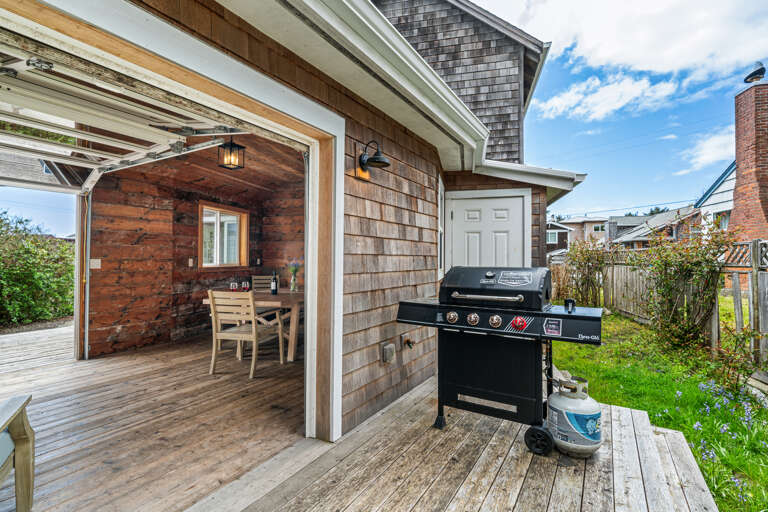 OSPREY NEST- Back deck with Gas BBQ and access to covered outdoor lounge area with picnic table, sofa, and chairs.  OSPREY NEST- Back deck with Gas BBQ and access to covered outdoor lounge area with picnic table, sofa, and chairs.
