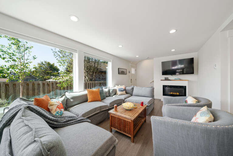 Living room with electric fireplace, Streaming TV, open to dining room and kitchen with Bar seating.  Living room with electric fireplace, Streaming TV, open to dining room and kitchen with Bar seating.