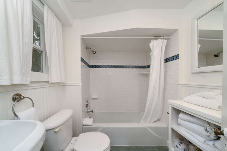 HUMMINGBIRD COTTAGE- Downstairs bath with shower/tub attached to queen bedroom HUMMINGBIRD COTTAGE- Downstairs bath with shower/tub attached to queen bedroom