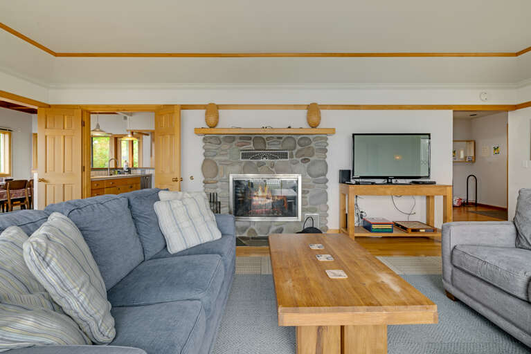 The living area on the main floor is open and expansive and offers a side reading room with desk and comfy chair, wood fireplace (wood not provided), comfortable sleeper sofa with lounge chair, Flat screen with cable TV,  and incredible ocean views.