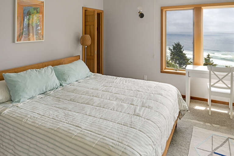 Master bedroom with a king bed, desk area, lounge chair, walk in closet, and master bath with sit down shower and dual sinks. Spectacular views!