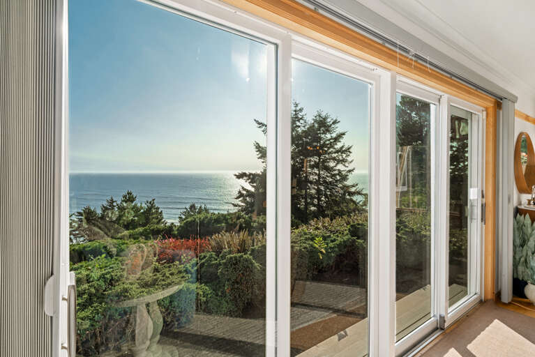 The living area on the main floor is open and expansive and offers a side reading room with desk and comfy chair, wood fireplace (wood not provided), comfortable sleeper sofa with lounge chair, Flat screen TV and incredible ocean views.