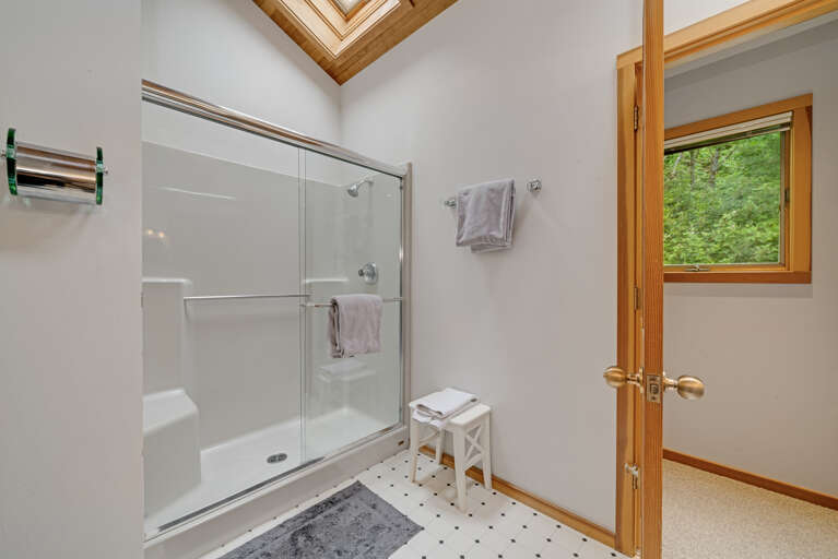 Master bath with sit down shower and dual sinks 