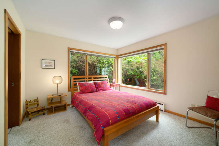 Main floor queen bedroom with access to the Main floor full bath with tub/shower combo.