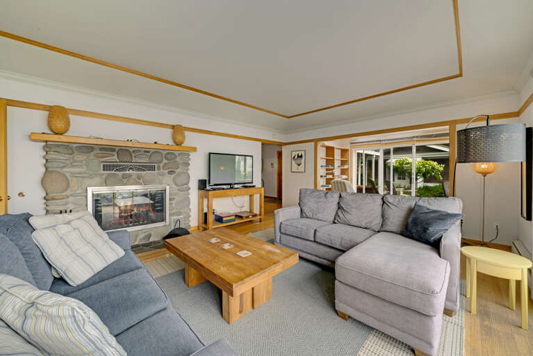 The living area on the main floor is open and expansive and offers a side reading room with desk and comfy chair, wood fireplace (wood not provided), comfortable sleeper sofa with lounge chair, Flat screen with cable TV,  and incredible ocean views.