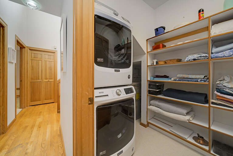 Kitchen with induction stovetop with specialty pans provided, Dishwasher, microwave, Oceanview, access to the living area. 