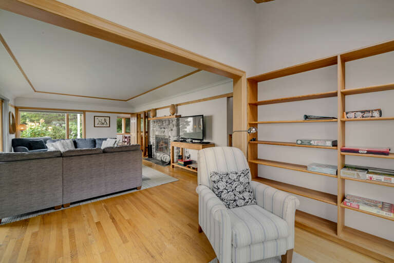 The living area on the main floor is open and expansive and offers a side reading room with desk and comfy chair, wood fireplace (wood not provided), comfortable sleeper sofa with lounge chair, Flat screen with cable TV,  and incredible ocean views.