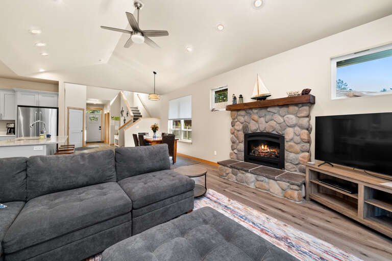 Comfortable living area with cable TV, streaming,  Gas Fireplace and access to patio with outdoor seating and Gas BBQ. 