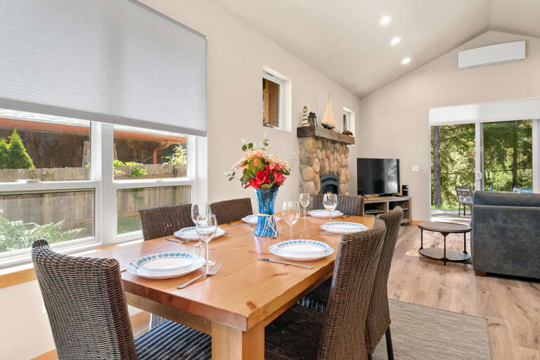 Open living area with dining for 6 at the table and 4 at the breakfast bar. 