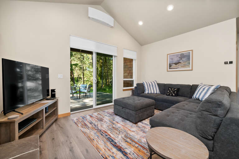 Comfortable living area with cable TV, streaming,  Gas Fireplace and access to patio with outdoor seating and Gas BBQ. 