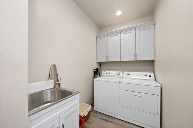 Laundry room on main floor with utility sink. 