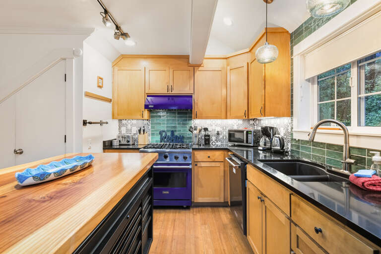 Wonderfully equipped kitchen including a Viking Gas range, Breakfast Bar, Dishwasher, Microwave
