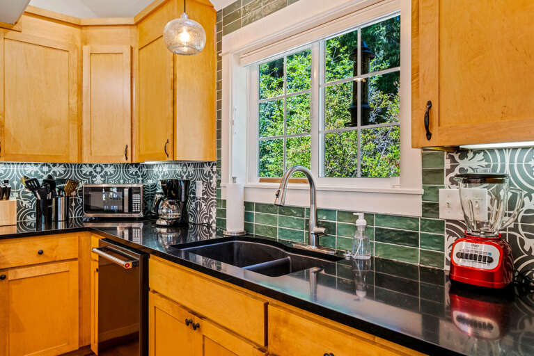 Open Living area with fully equipped kitchen including a Viking Gas range, Breakfast Bar, Dishwasher, Microwave