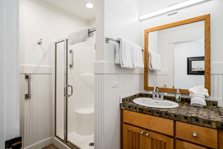 Main floor bath with walk-in shower and soaker tub
