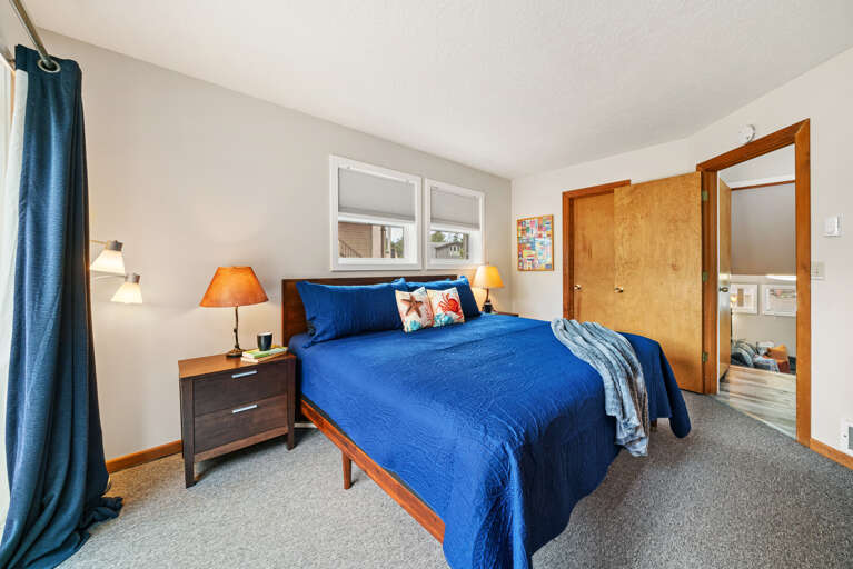 King bedroom with access to the back yard and deck, streaming TV, Master bath with Jacuzzi tub. 