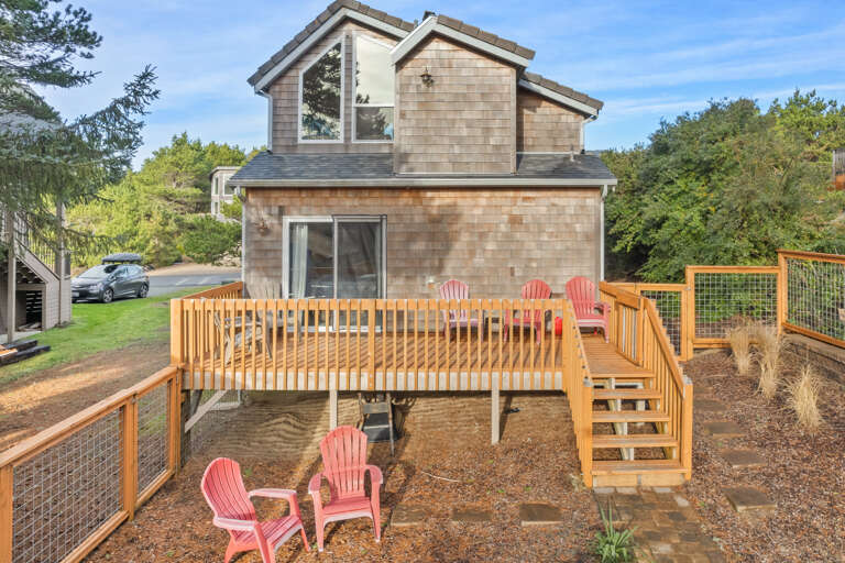 Back deck and outdoor patio with outside dining table and chairs