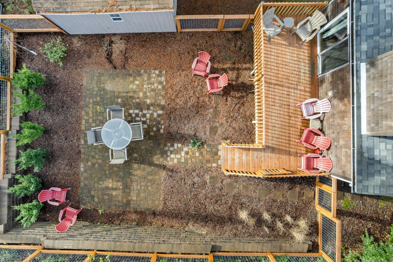 Back deck and outdoor patio with outside dining table and chairs