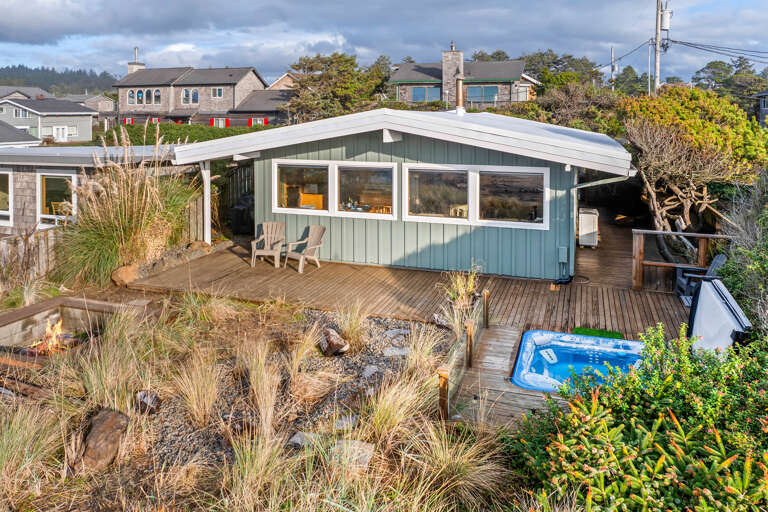 Ocean side view with hot tub and firepit.
