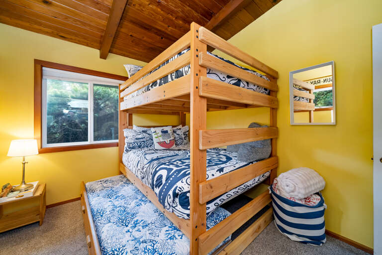 Kids room with double size bunk beds and a double trundle