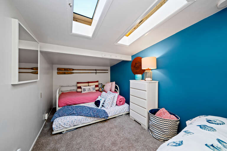 Cabana bedroom with queen bed and twin bed with twin trundle