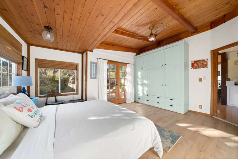 Master bedroom with king bed, attached master bath with large soaker tub and access to the garden area with Sauna and Hot tub. 