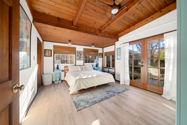 Master bedroom with king bed attached master bath with large soaker tub and access to the garden area with Sauna and Hot tub. 