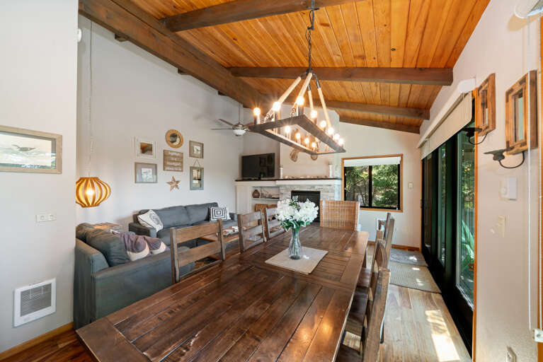 Dining/living room area with Gas fireplace/ Cable Tv DVD with access to Deck