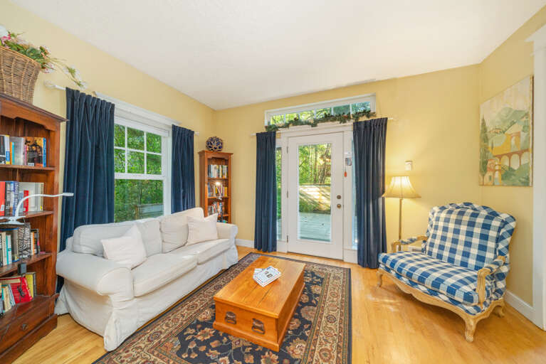 Sitting room with access to Kitchen, back deck with outdoor seating, hot tub and gas bbq